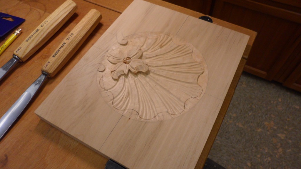 Carving a shell for a drawer front.