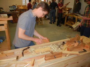 Caleb James demonstrating the beauty of his hand-made planes.