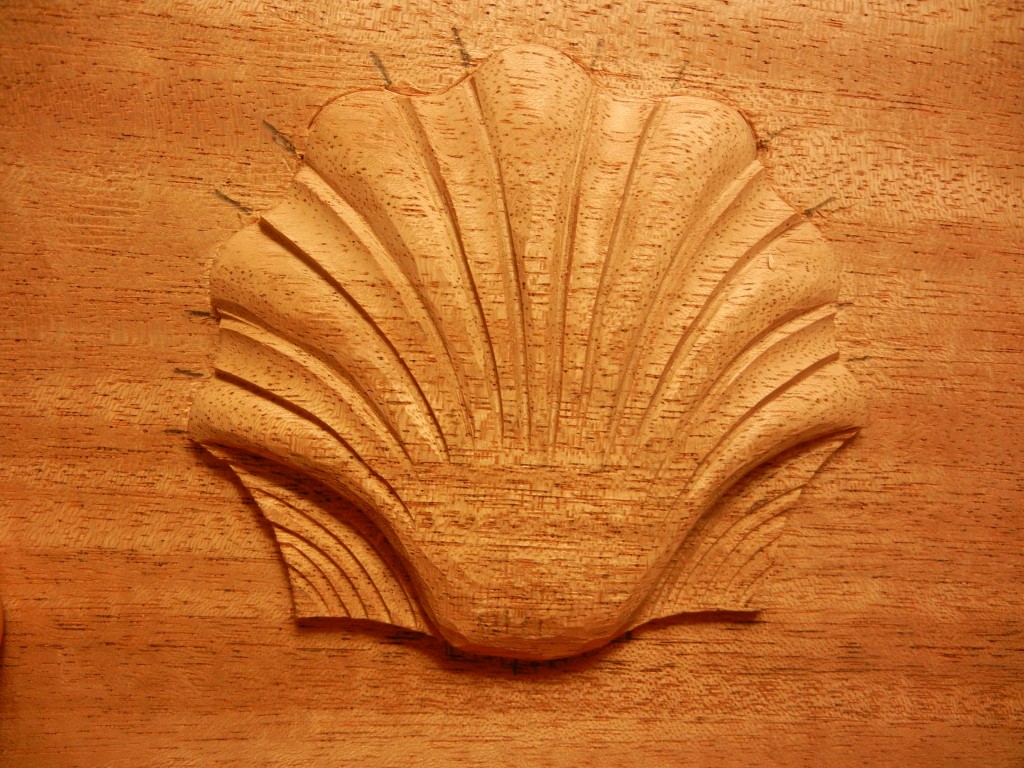 Shell carving in mahogany.