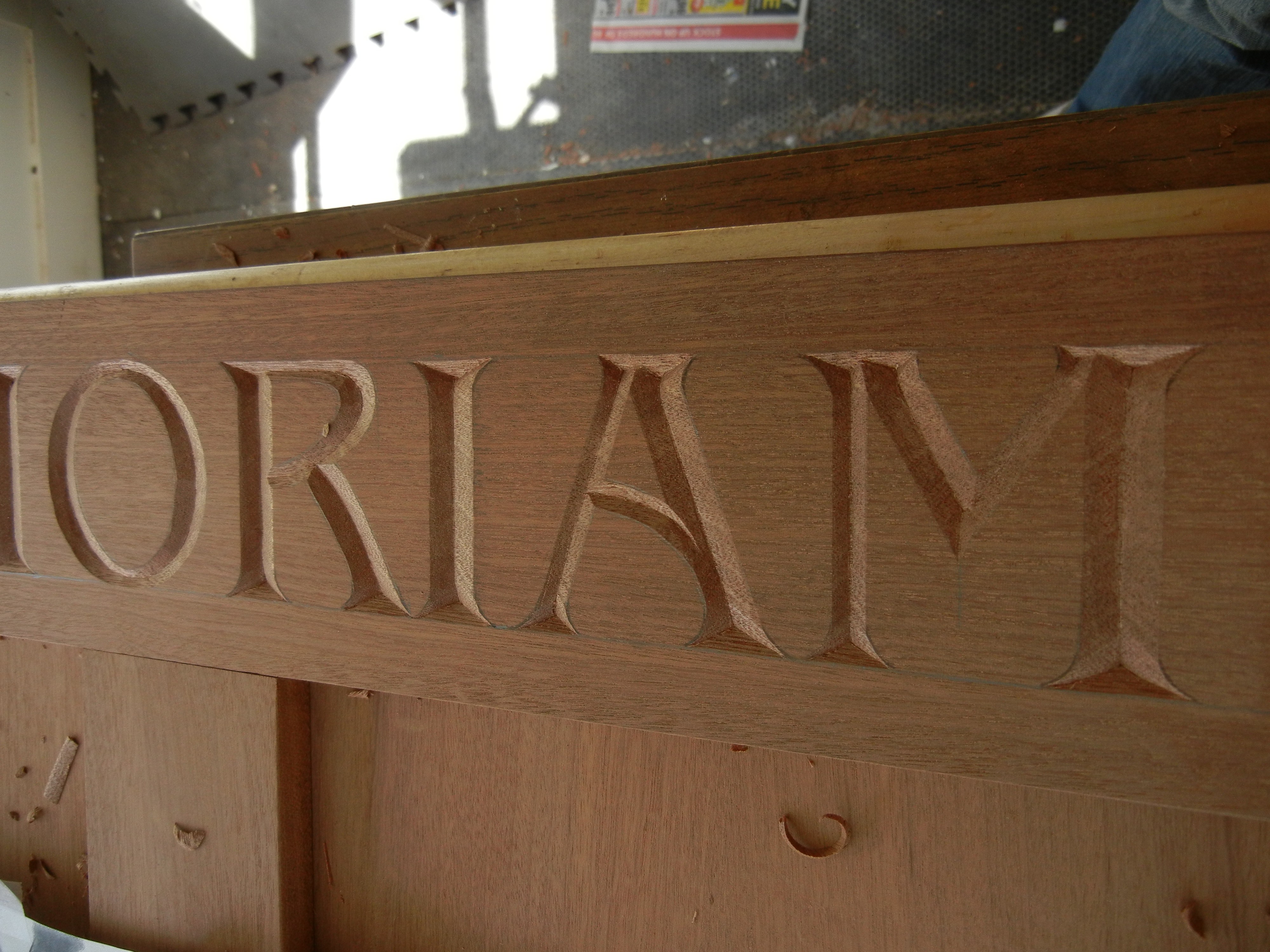 Letter carving for a memorial sign - Mary May - Woodcarver