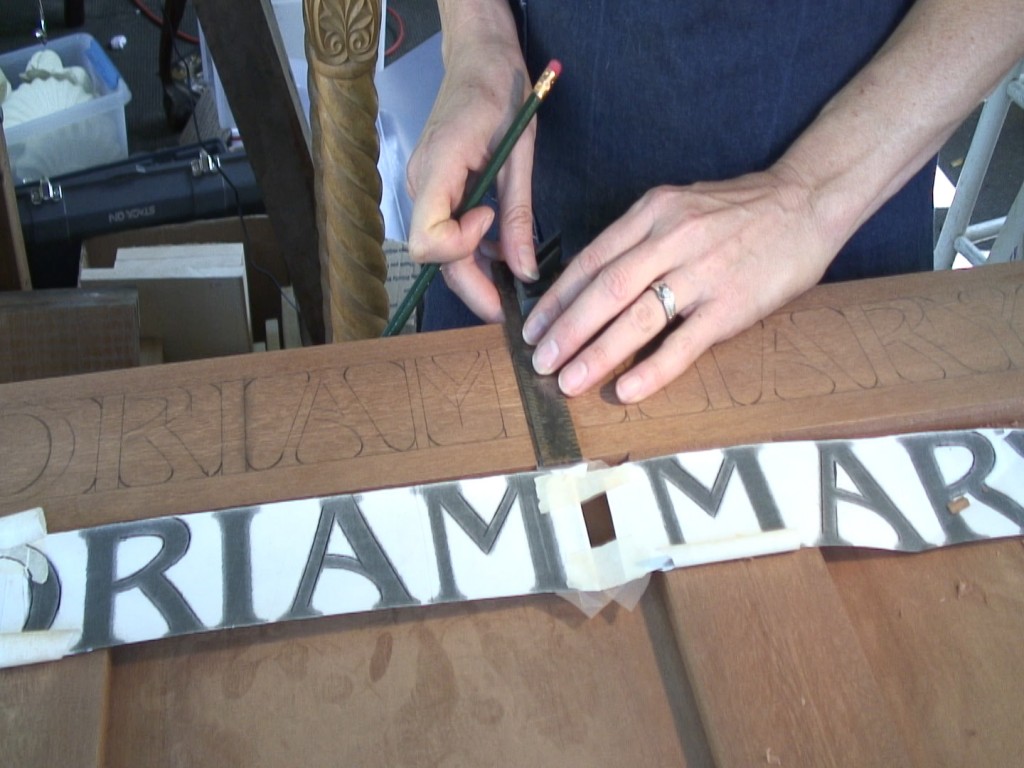 Transferring all vertical lines of the lettering with a square.