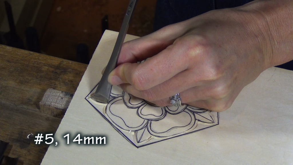With gouges that fit the outside edges of the rose, make vertical cuts (I used the #5, 14mm, #7, 12mm, and #4, 18mm)