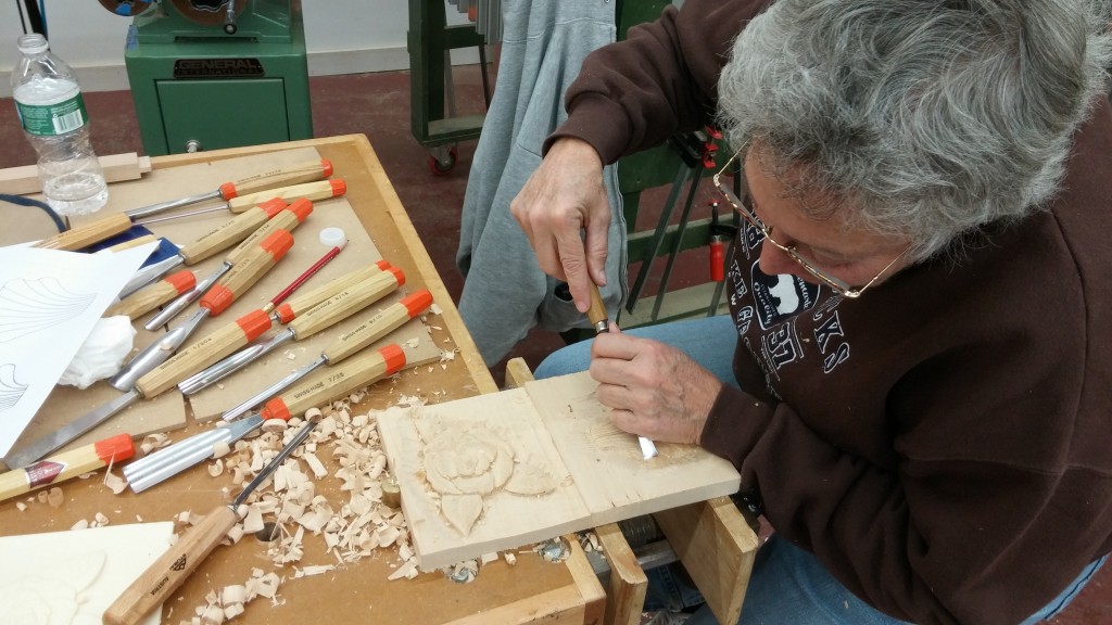 Camellia flower and shell carving in basswood.