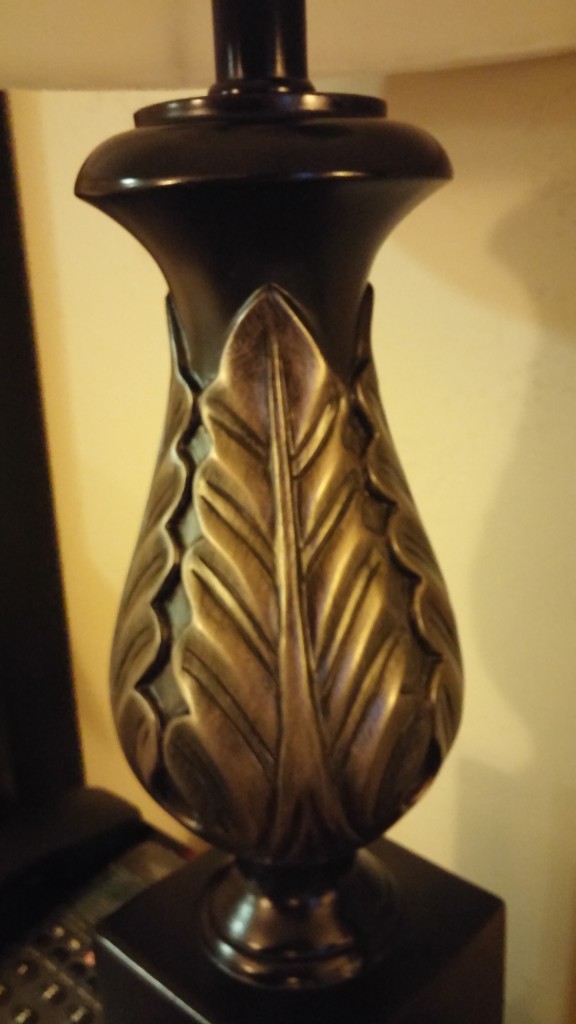 design on a lamp base - almost an acanthus leaf.